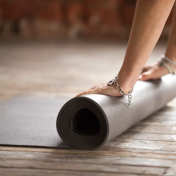 hands-rolling-fitness-mat-concept-healthy-lifestyle (1)